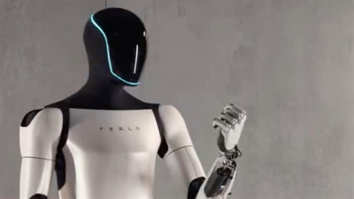 Elon Musk's Optimus robot serves popcorn at Tesla diner