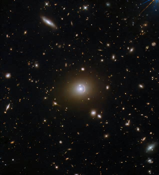 Hubble captures distant galaxy's light bent into a partial Einstein ring