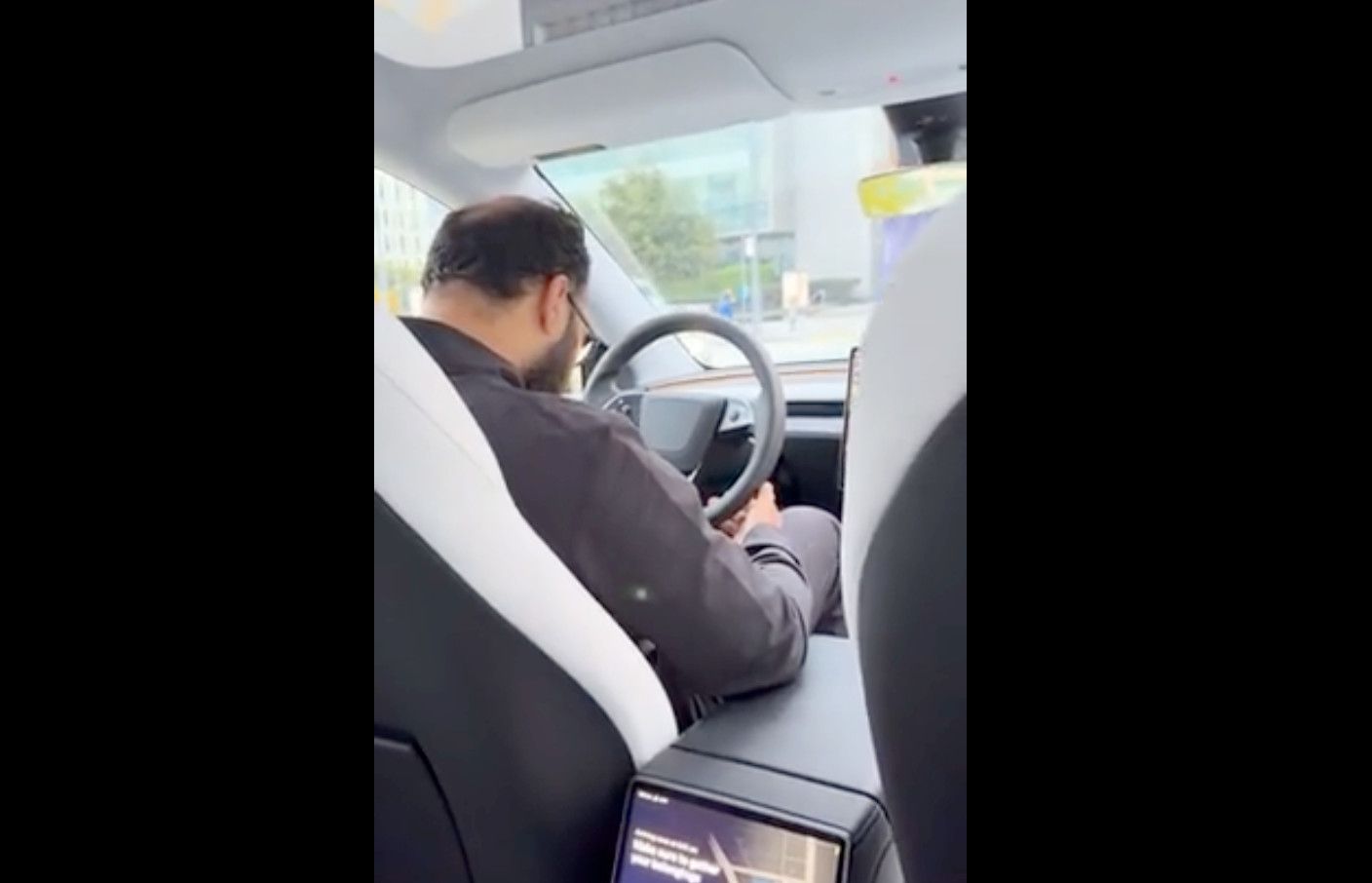 Tesla Human Robotaxi Driver Falls Asleep at the Wheel While Driving Passenger, Video Goes Viral