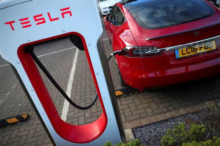 Analysis-Tesla's EV charging team layoffs threaten to slow Biden's program to electrify highways
