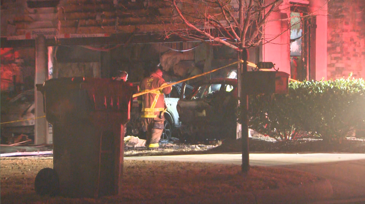 Family displaced after car fire spreads into home, cause under investigation